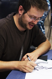 An attendee does some sketching.